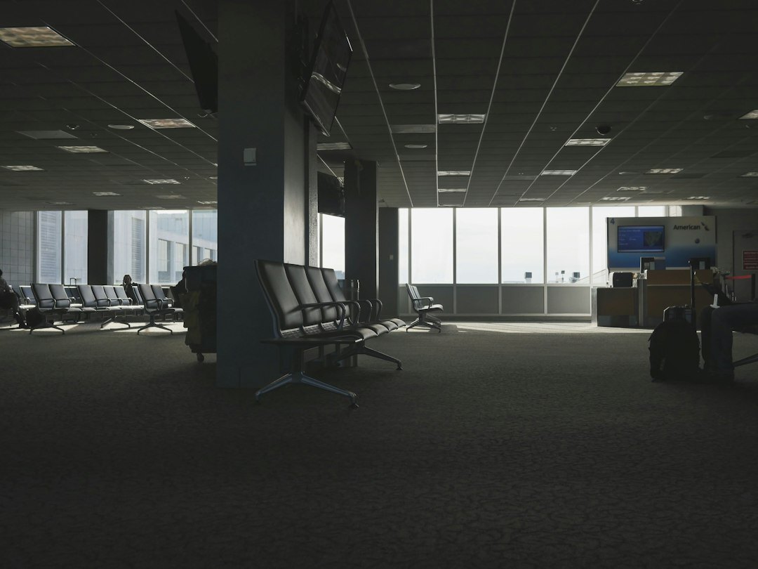 Reception area of a broadcast training academy with monitors on the wall
